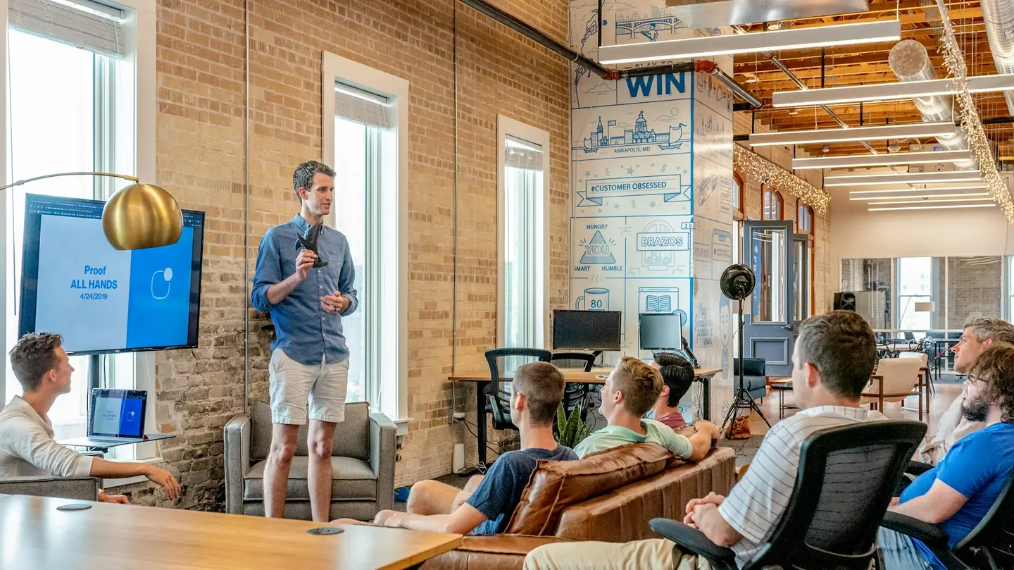 Team watching a presentation in a converted loft office